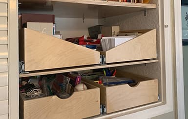 Sloped overhead cabinet pull-out shelf