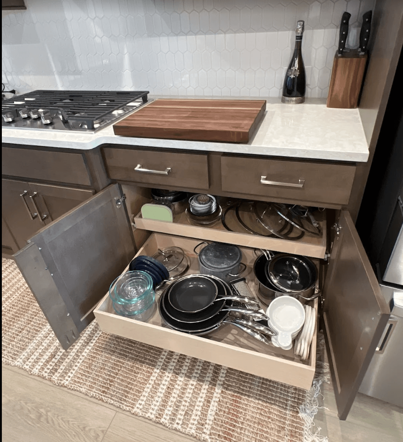 Pots and pans organized in custom pull-out shelves