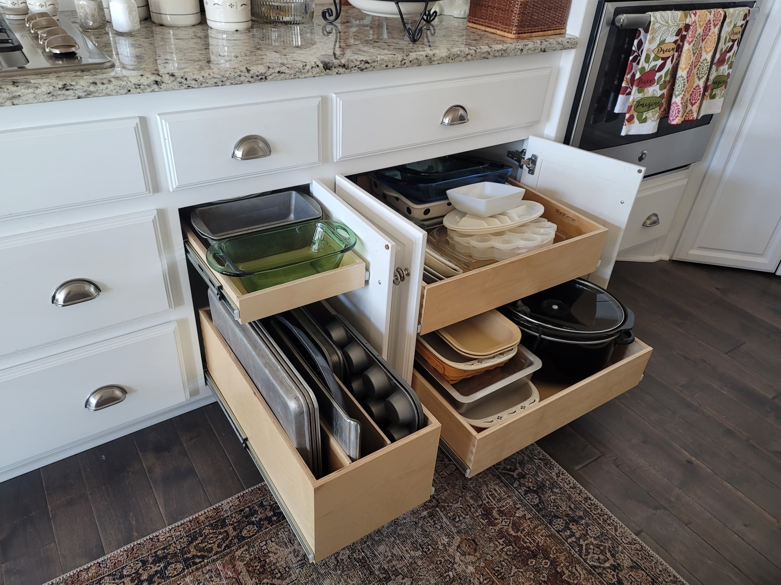 Custom pull-out shelf with pots and pans organized