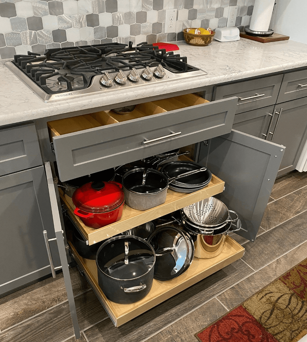 Pots and pans pull-out shelf under cooktop