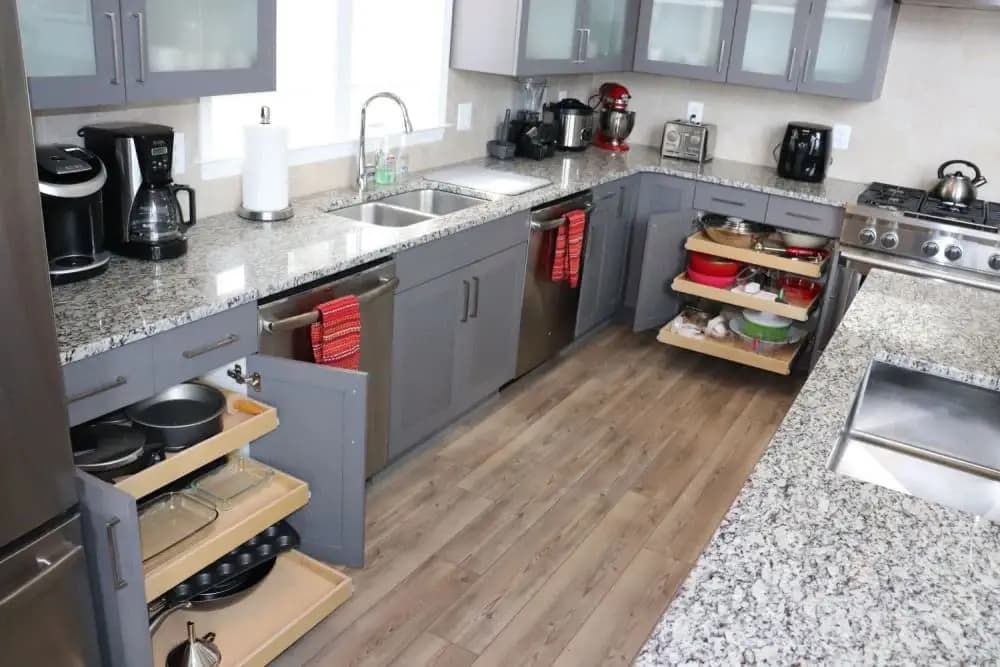 Kitchen cabinet after custom pull-out shelves — organized and accessible