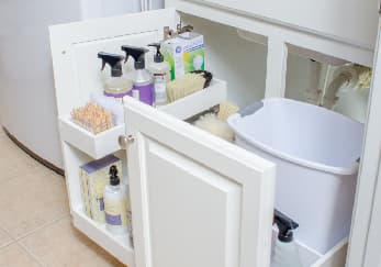 Custom pull-out shelving solution for trash & recycling